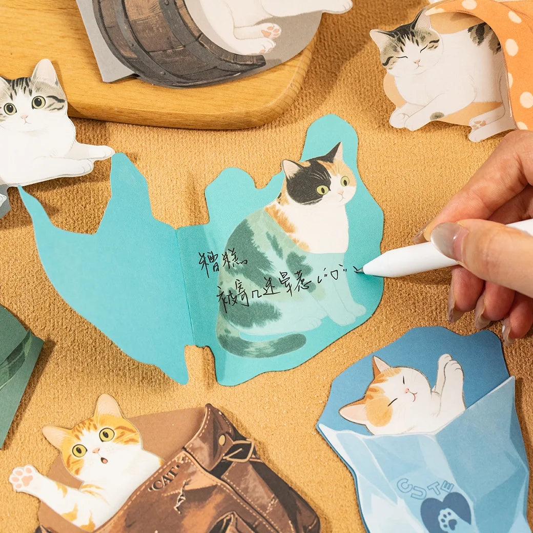 cat sticky note being written on